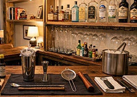 Modern home bar setup with wine and cocktail accessories