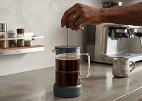 Stainless steel French press used for coffee brewing in Kenya