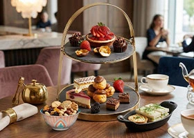 Complete serveware collection including cast iron, ceramic bowls, tiered stands, and serving boards available in Kenya