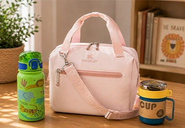 Child preparing for school with everyday lunch and hydration essentials